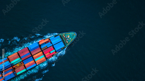 Aerial view from drone, Container ship or cargo shipping business logistic import and export freight transportation by container ship in open sea, Container loading cargo freight ship boat.