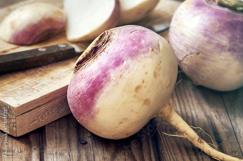 Closeup of raw organic turnips on rustic wooden background