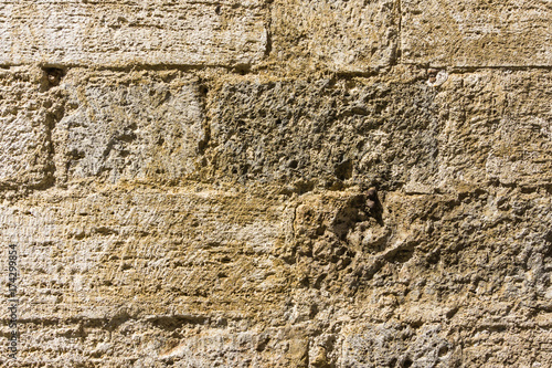 Texture of wall in italian tuscany town from tuf stone