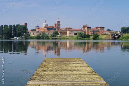 Sunny day over the artificial lake that surrounds the Renaissance architecture city in the northern Italian region of Lombardy