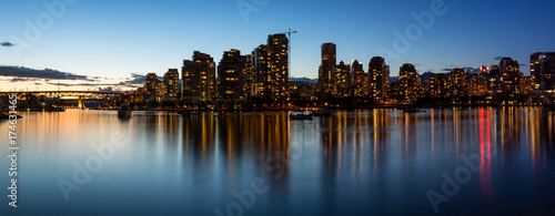 Panoramic Skyline of Vancouver Downtown in False Creek, British Columbia, Canada. Taken during a colorful sunset.