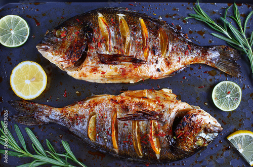 roasted sea bream fish with lemon slices