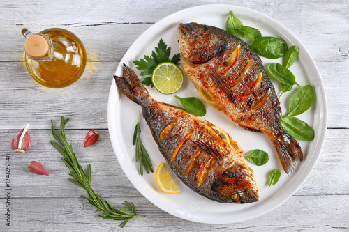 roasted sea bream fish with lemon slices