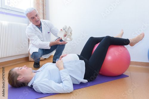 pregnant women and doctor doing excersices