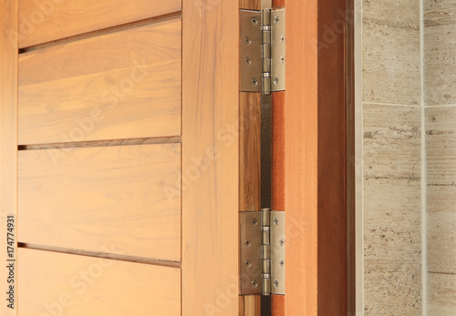 Wooden door with hinge