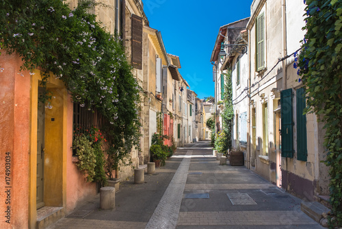 Arles in the south of France, typical paved side street of the city center 