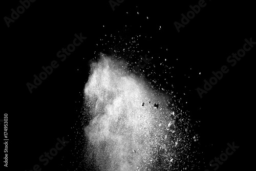 Explosion of white dust on black background.