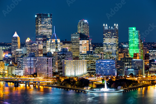 Pittsburgh downtown skyline by night. Located at the confluence of the Allegheny, Monongahela and Ohio rivers, Pittsburgh is also known as "Steel City", for its more than 300 steel-related businesses