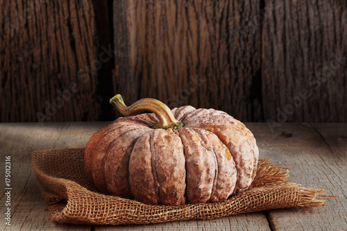 Pumpkin with wood background.