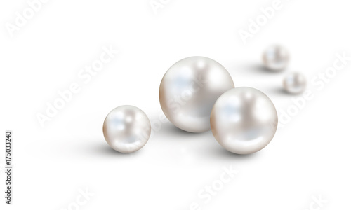 White pearls on white background with two out of focus