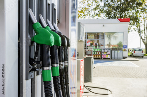 Gasoline and diesel distributor at the gas station. Gas pump nozzles.