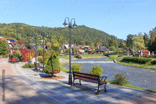 Polish Spa Szczawnica in autumn. Promenade on stream Grajcarek