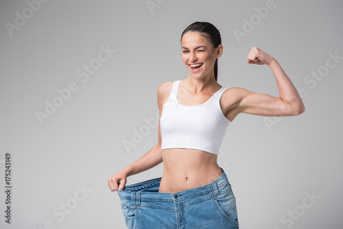 Happy young woman lost her weight