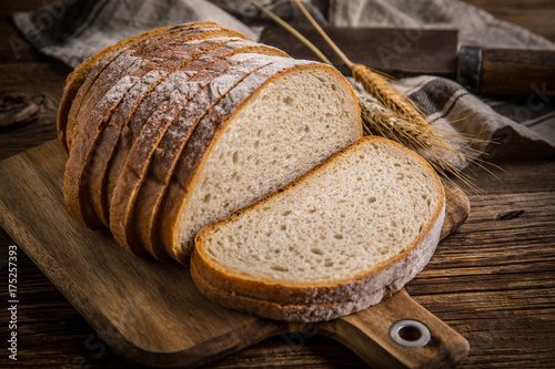 Sliced loaf of bread on a chopping board.