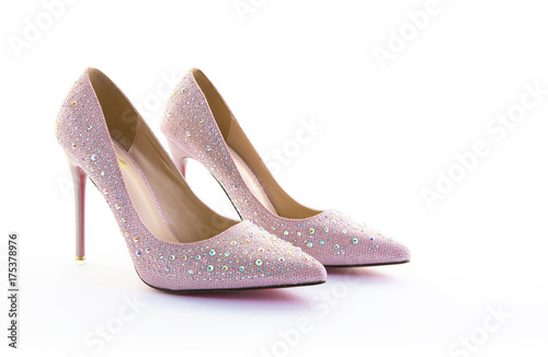Pair of pink sparkly high heel shoes on a white background