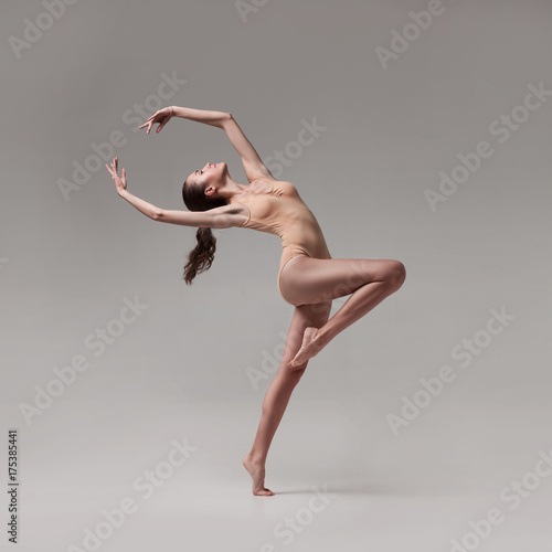 young beautiful ballet dancer in beige swimsuit