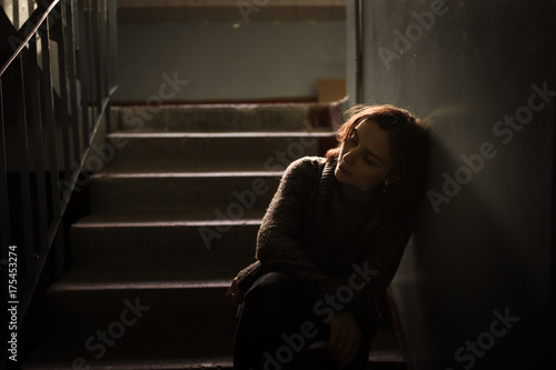 woman in sweater at the steps, dark style