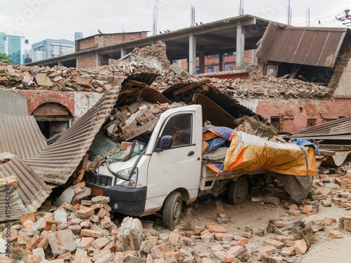 Aftermath of Nepal earthquake 2015, crushed minivan in Kathmandu