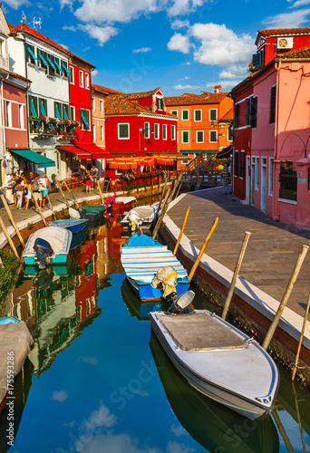 Burano island in Venice Italy picturesque over canal with boats