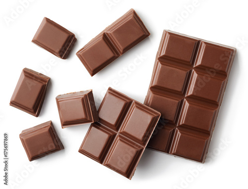 Milk chocolate pieces isolated on white background