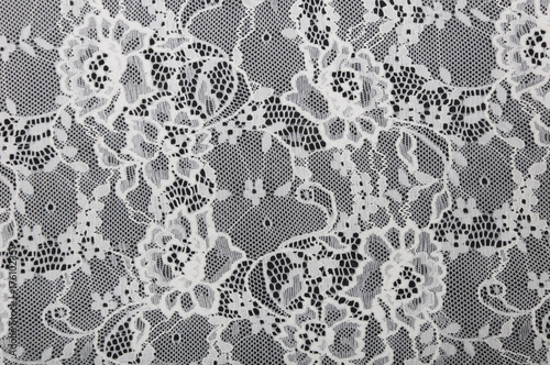 white floral lace on a black background