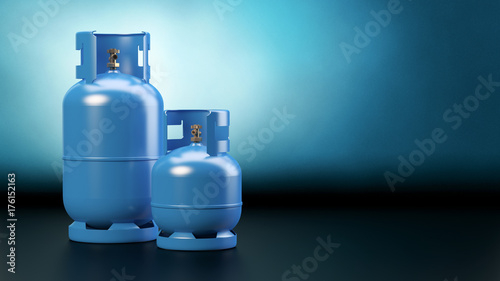 Two blue gas bottles - dark background