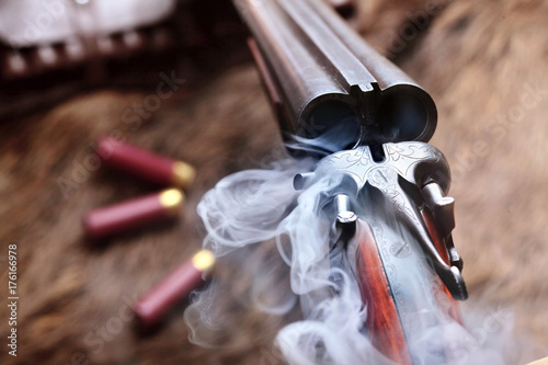 Smoke from a hunting double barrel vintage shotgun after firing.Comcept hunting.Closeup