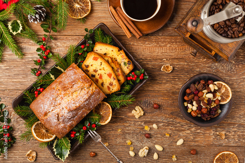 Christmas fruitcake. Natural wooden background.