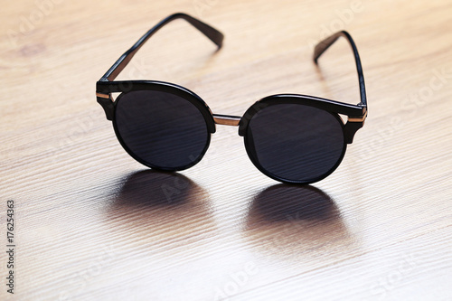 sunglasses on wooden table