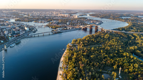 Aerial top view of Kyiv skyline, Dnieper river and Truchaniv island from above, sunset in Kiev city, Ukraine 