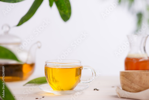 Cups of tea on wooden table background