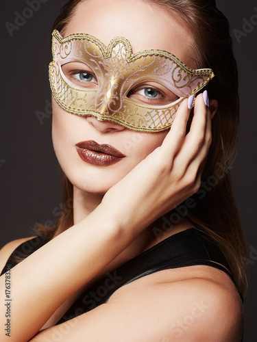 Beauty model girl in Carnival Mask