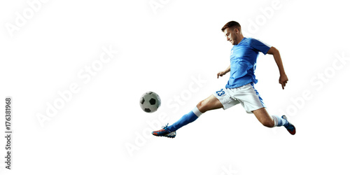 Soccer player performs an action play and beats the ball. Isolated football player in unbranded sport uniform on a white background.