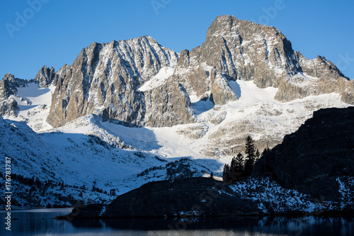 Sunrise on Banner Peak above Garnet Lake in the Ansel Adams wilderness after a fresh snow