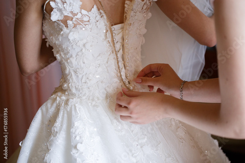 beautiful bride dress decorated with beads and lace