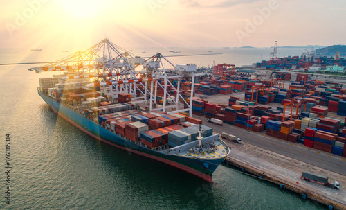 container ship in import export and business logistic.By crane ,Trade Port , Shipping,cargo to harbor.Aerial view.Water transport.International.Shell Marine.Top view.