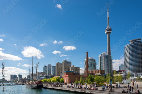 People enjoying beautiful sunny afternoon near lake Ontario in Toronto