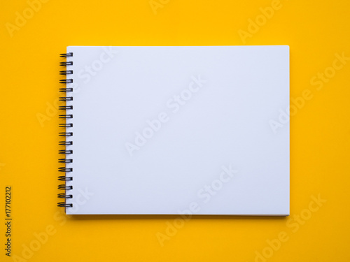 Notepad on yellow background