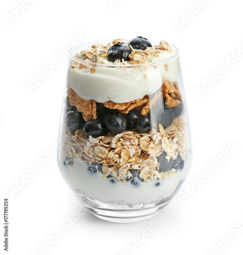 Healthy breakfast with oatmeal and blueberry in glass on white background