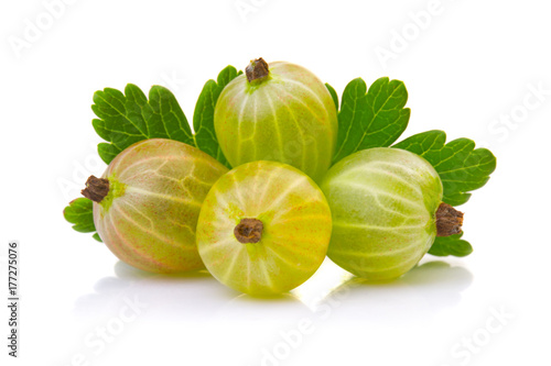 Ripe green gooseberries with leaves isolated on white background