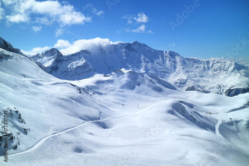Winter mountain panorama with fresh snow on skiing tracks, Meribel slopes, 3 Valleys resort, Alps, France