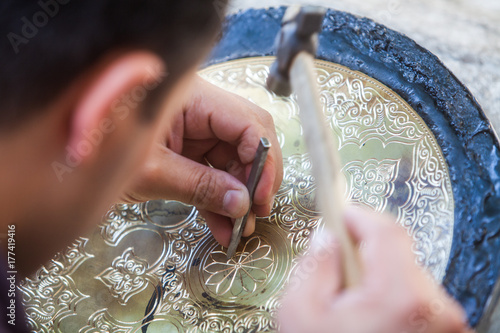 Artisans carving plates