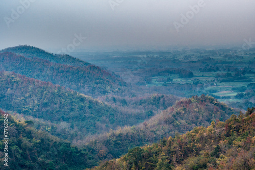 Drought mountains in autumn with pollution in sky