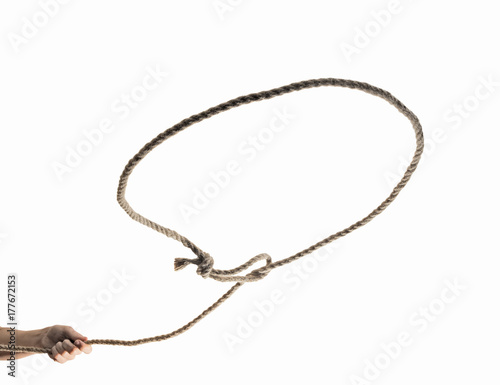 A lasso loop in the hands of a person, close-up on isolated white background.