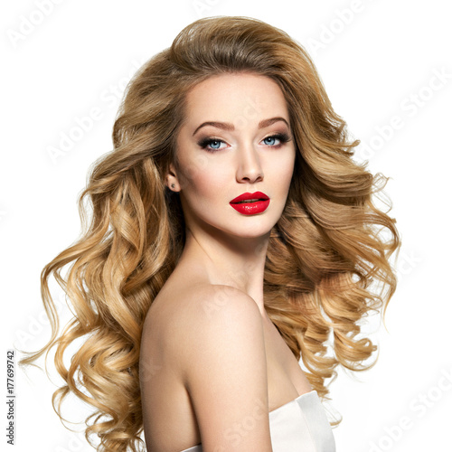 Pretty woman with long hair and red lips.