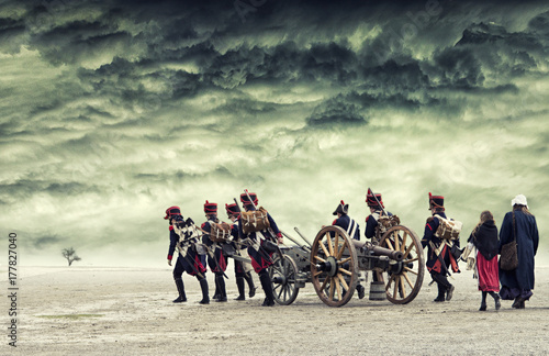 Napoleon soldiers marching in open land with dramatic sky above. The Battle of the Three Emperors. The Battle of Austerlitz.