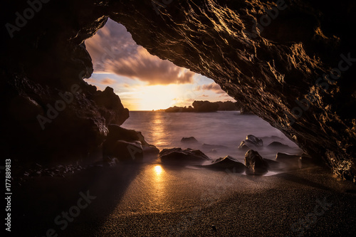 Lava tunnel at sea at sunset, maui island cave, hawaii, usa