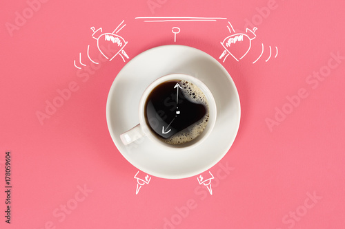 Clock. Cup of fresh espresso with clock sign on pink background