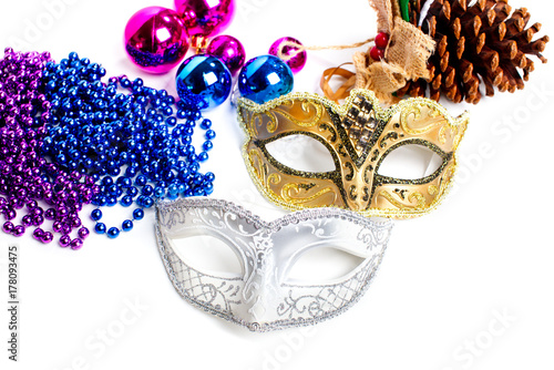 New Year's background. Masquerade. Maxi and Christmas decorations on a white background.