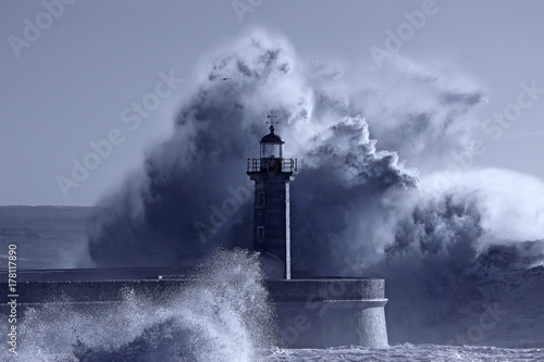 Lighthouse in the middle of stormy waves